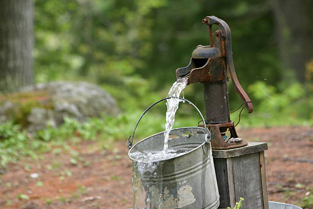 cool & refreshing antique water pump wells stock pictures, royalty-free photos & images