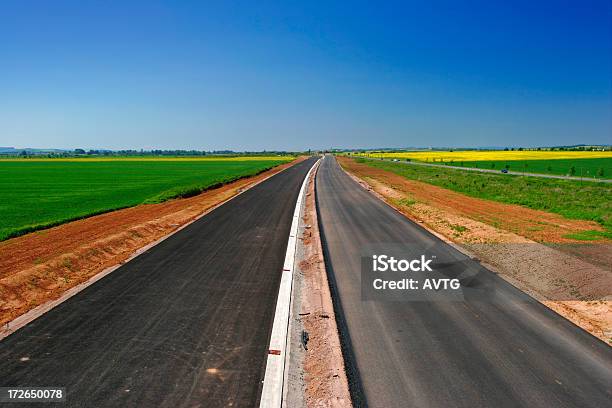 Highway Under Construction Stock Photo - Download Image Now - Agricultural Field, Asphalt, Blue