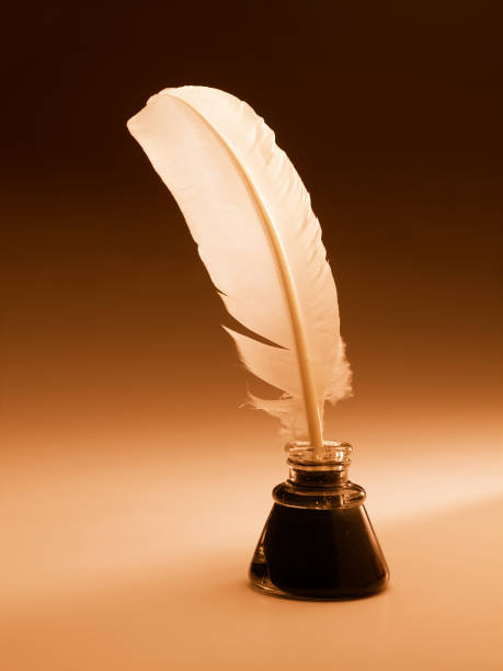 istock Feather quill in ink well 172650997