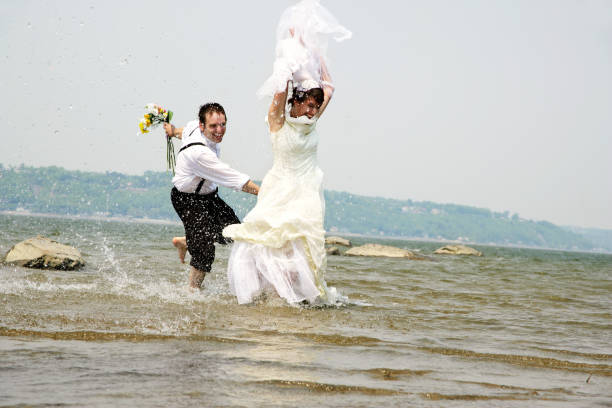 istock Just married running in water VI 172651167