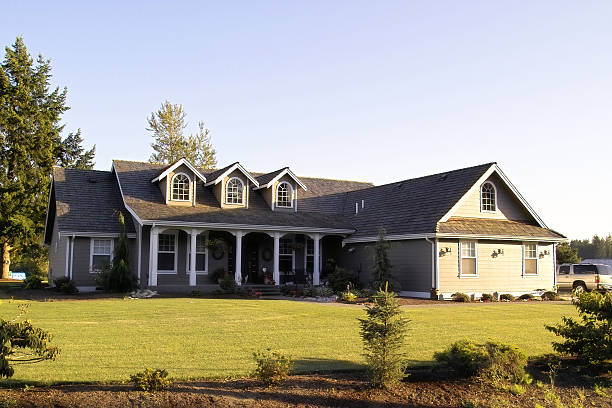 Country Ranch Style Home Photograph of a modern country home at sunset. ranch stock pictures, royalty-free photos & images