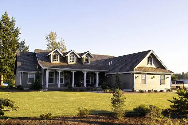 Photograph of a modern country home at sunset.