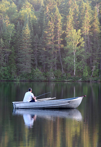 istock Peaceful Fisherman in Small Boat 172651366