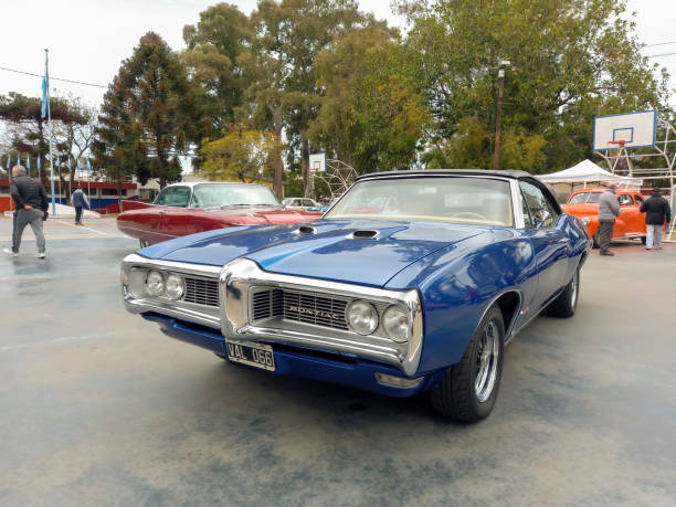 old blue sport 1969 pontiac gto convertible in a park. classic luxury muscle racing car. - pontiac gto imagens e fotografias de stock