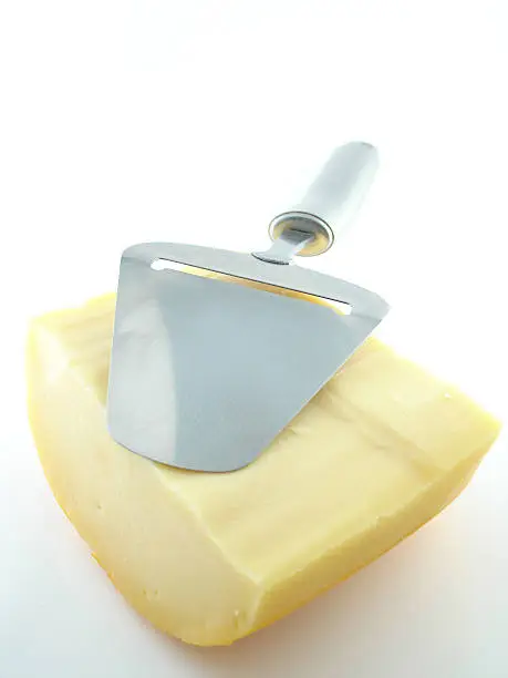 Cheese with a cheese slicer on top.