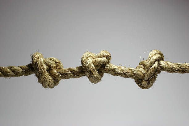 tres problemas - tied knot rope adversity emotional stress fotografías e imágenes de stock