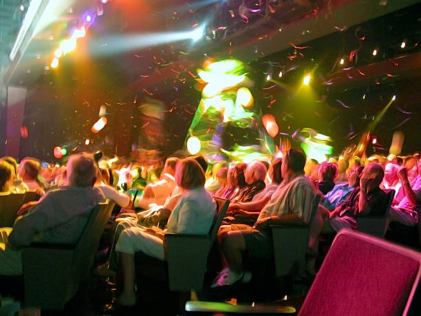 Audience in Theater Seating with Confetti Floating Down