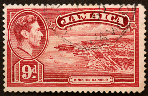 postage stamp showing an arial view of the harbor at Kingston, Jamaica.