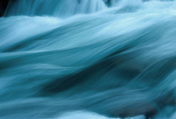 Abstract Flowing Water Made from a natural site with enhanced color flowing photos stock pictures, royalty-free photos & images