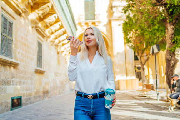 istock Young woman sending a voice message in Malta 1726546164