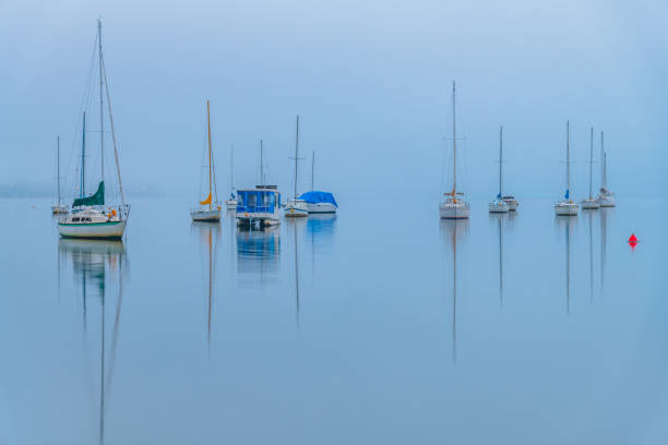 istock Fog, sunrise and boats on the bay 1726546853