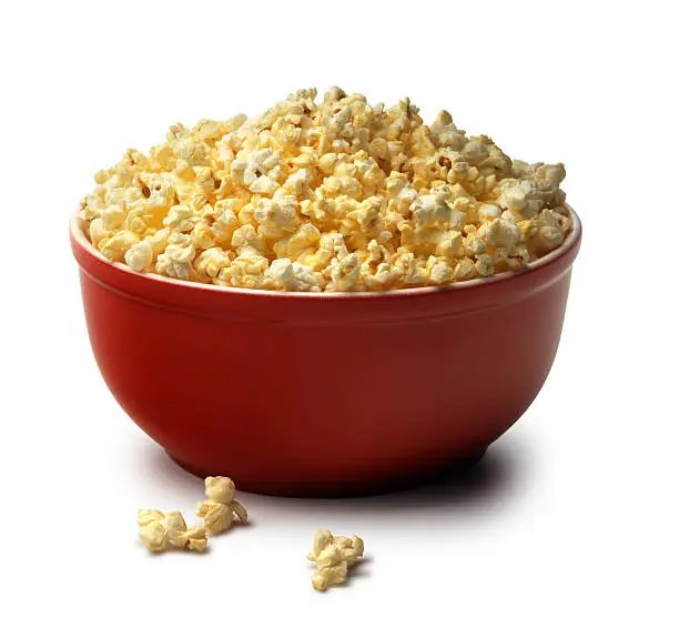 Photo of Red bowl of popcorn on a white background