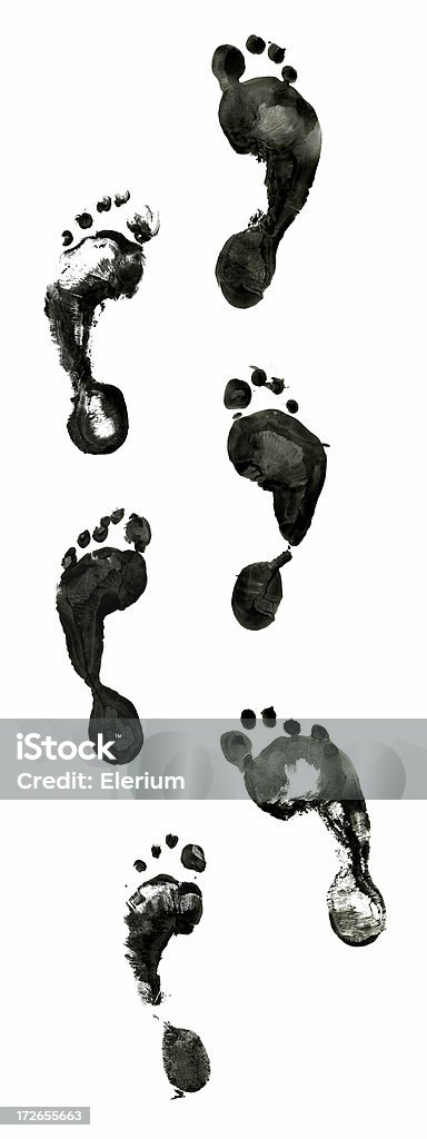 Six Feet Inked Six different inked feet. Perfect for creating a walked path using different feet. Footprint Stock Photo