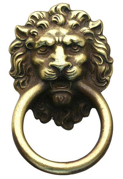 Lion Head Door Knocker Lion's head door knocker isolated on white. lions head mountain stock pictures, royalty-free photos & images