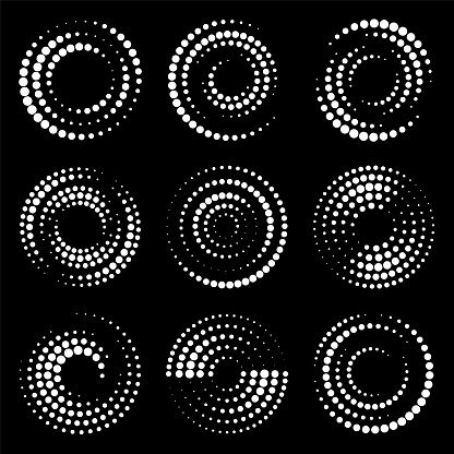 Set of different circles for design. Halftone effect. White circles on a black background.