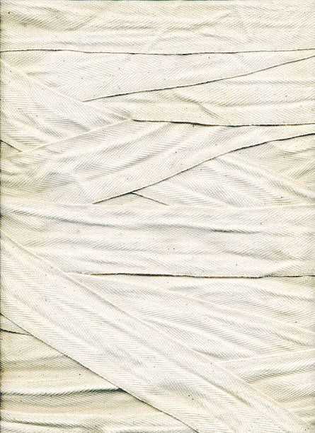 Bandage Background This is a hi-res image of boxing wraps wound on a flat surface. It might make an interesting background texture or image. mummified stock pictures, royalty-free photos & images