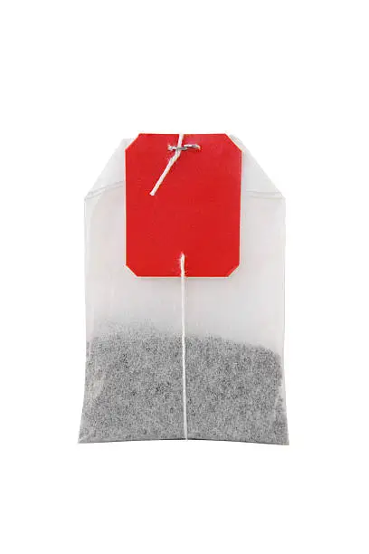 Single tea bag of black tea with red label