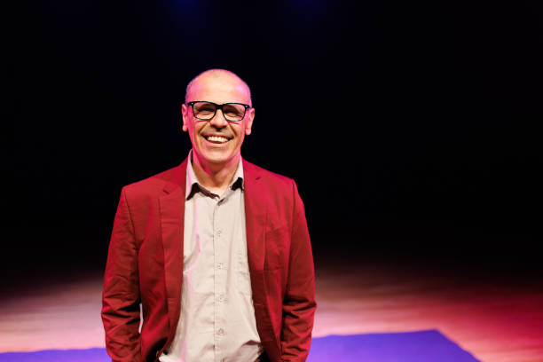 istock Man wearing eyeglasses and suit smiling 1726578337