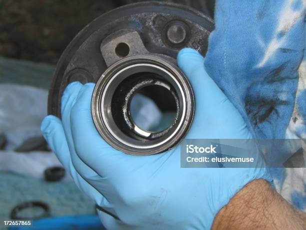 Auto Mechanic Repairs The Bearing Hub Stock Photo - Download Image Now - Ball Bearing, Wheel, Mechanic