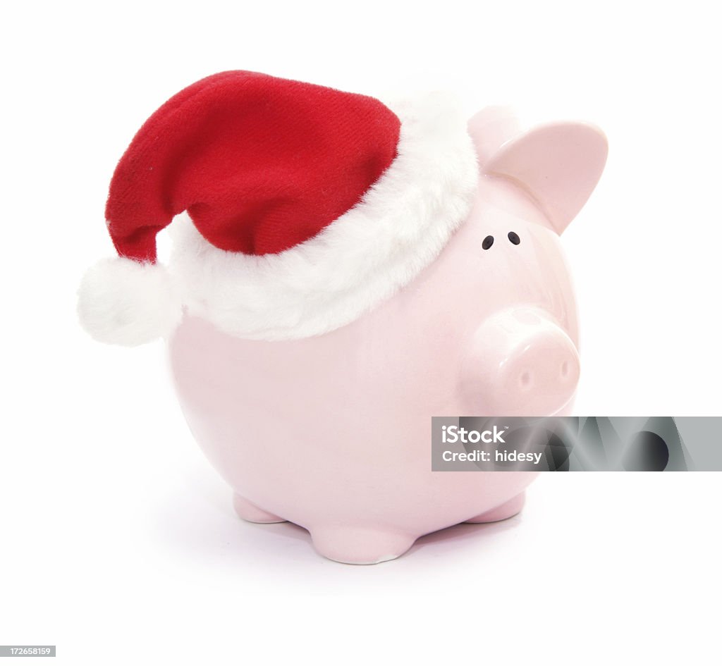 Christmas Savings Piggy bank with Christmas Hat Banking Stock Photo