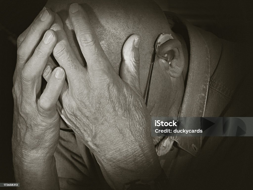 Grief A grieving senior man. Grain added. 70-79 Years Stock Photo