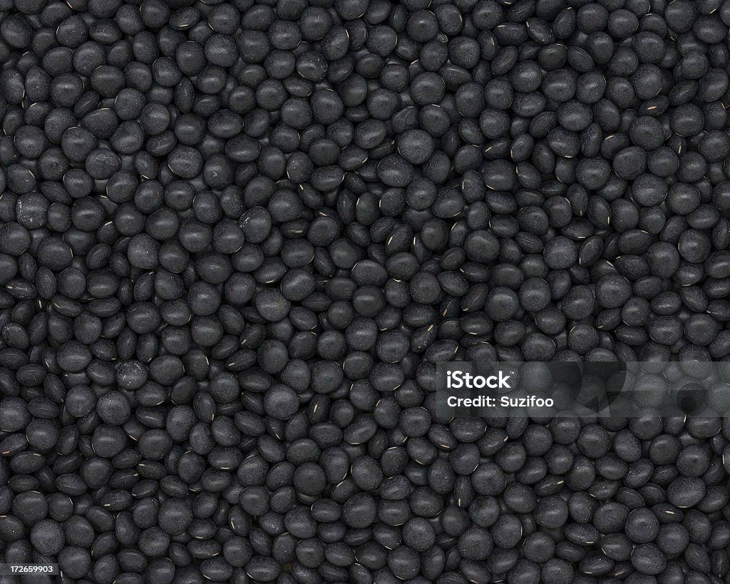 beluga lentils "Black beluga lentils, so named because when cooked they glisten which makes them look like beluga caviar." Black Color Stock Photo