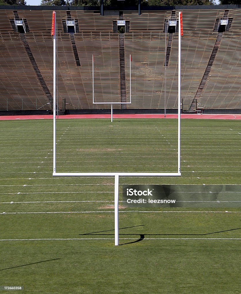 Football Field Goal Posts Goal posts and field in empty football stadium. End Zone Stock Photo