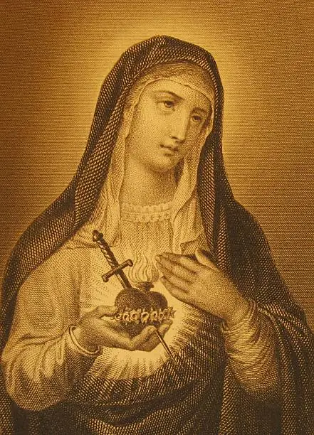 "close-up of an antique etching made in 1899 with a picture of Saint Mary, the Mother of Jesus.Antique etchings stock photo:"