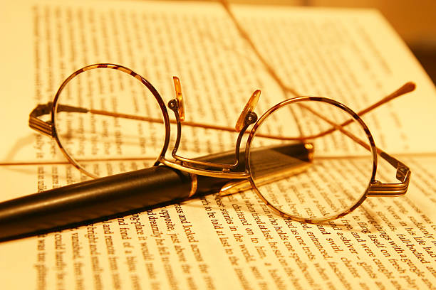 istock glasses, book and fountain pen 172660562