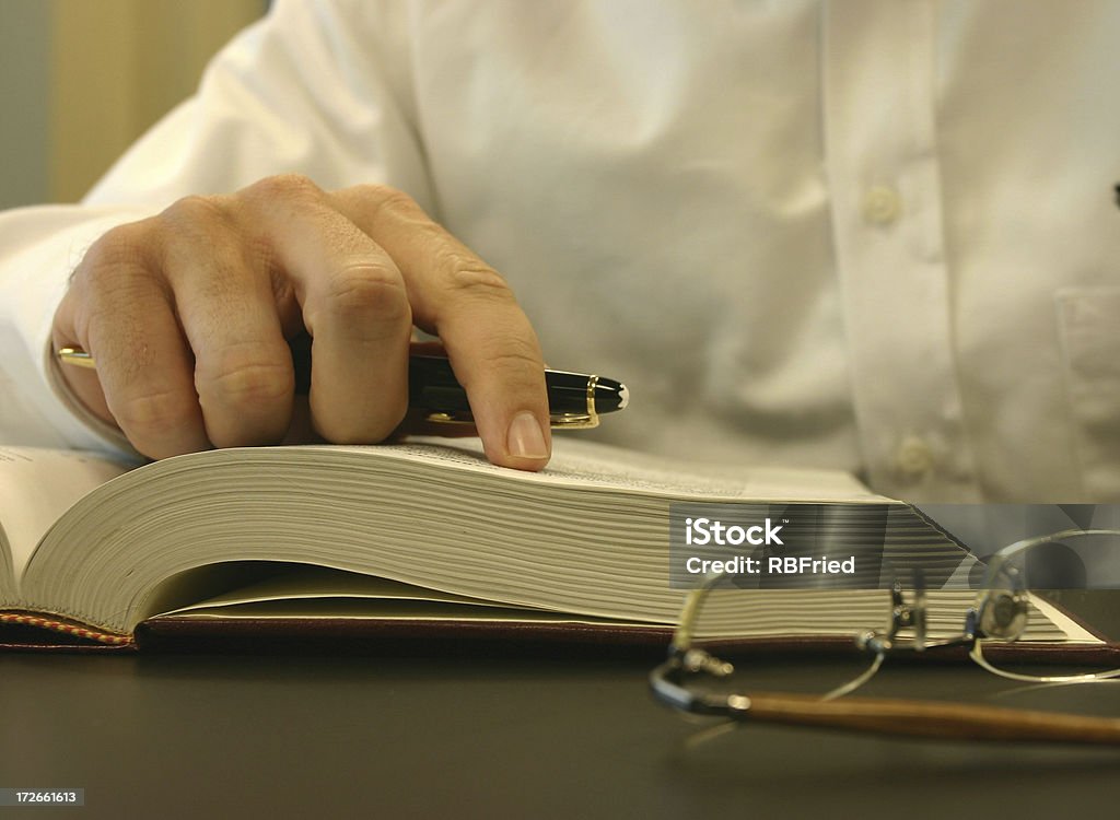 Business Reading a businessman reading Law Stock Photo