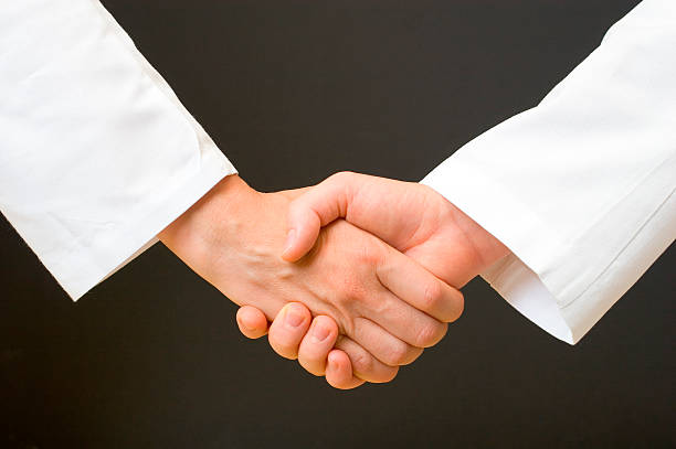 Medical people handshake Medical people handshake. sleeve stock pictures, royalty-free photos & images