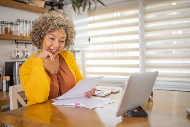 istock Senior woman is going through bills and finances 1726619311