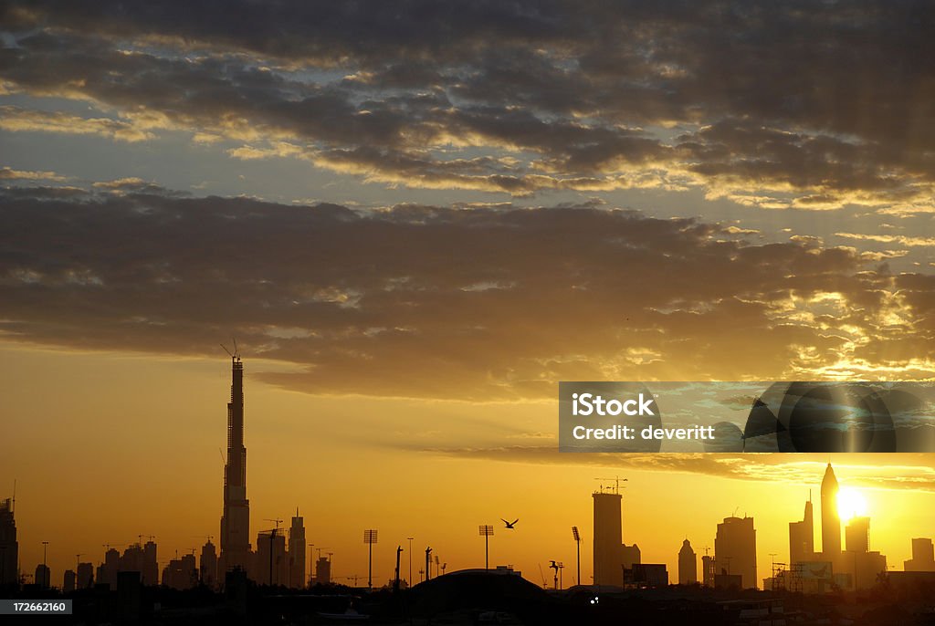 Burj Khalifa Sunset A rare cloudy sunset in Dubai. The Burj Dubai on the left and Jonathan Livingston Seagull center frame. Burj Khalifa Stock Photo