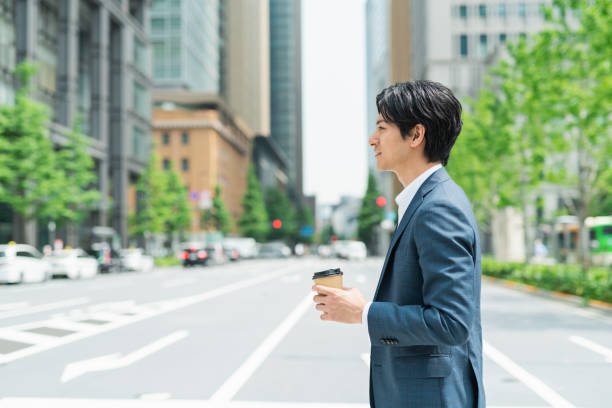 istock Young businessman crossing a pedestrian crossing 1726622486