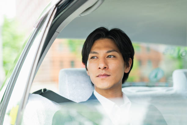 istock Young businessman in a cab 1726623561