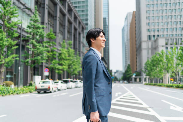 istock Young businessman crossing a pedestrian crossing 1726624620
