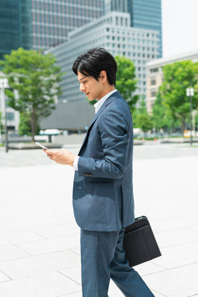 istock Young businessman commuting through a building district 1726625153