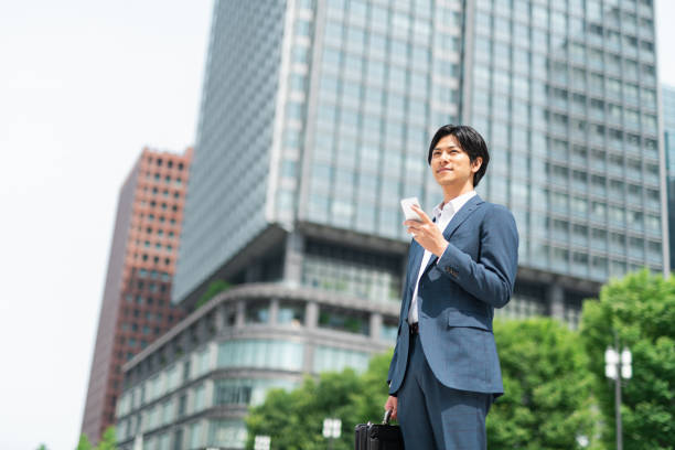 istock Young businessman commuting through a building district 1726625663