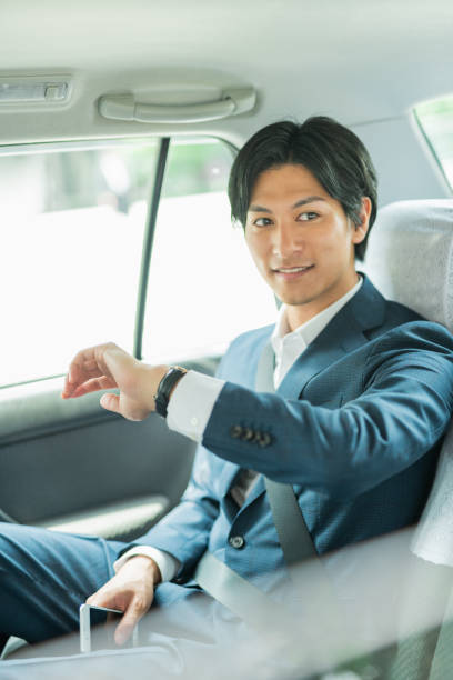 istock Young businessman in a cab 1726630101