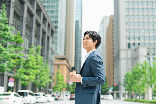 istock Young businessman crossing a pedestrian crossing 1726633300