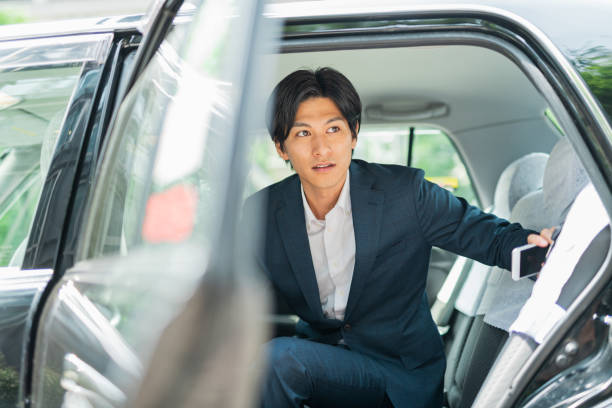 istock Young businessman getting out of a cab 1726633845