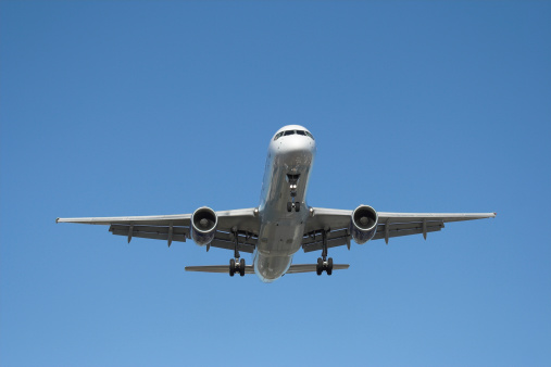 Passenger Jetliner on arrival. Blue contrast