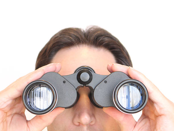 istock Front Facial View of Caucasian Man Looking Through Black Binoculars 172663930