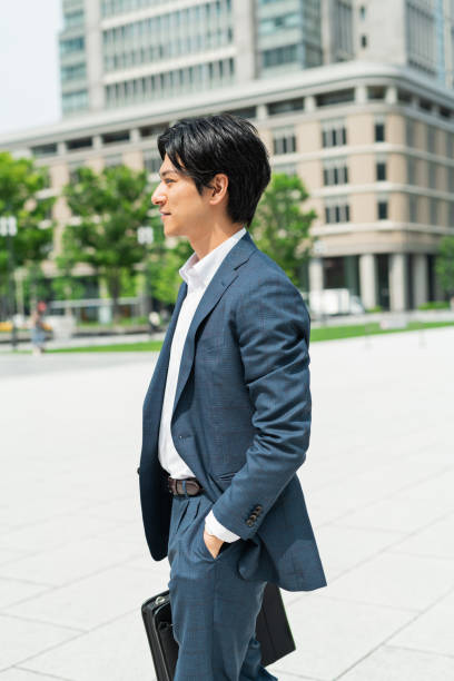 istock Young businessman commuting through a building district 1726644675