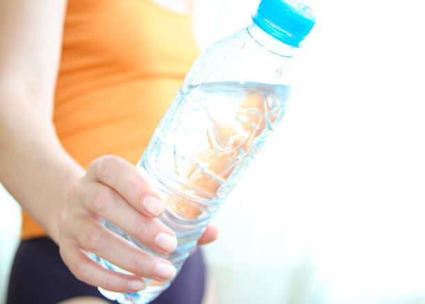istock A woman showing off her water bottle 172664545