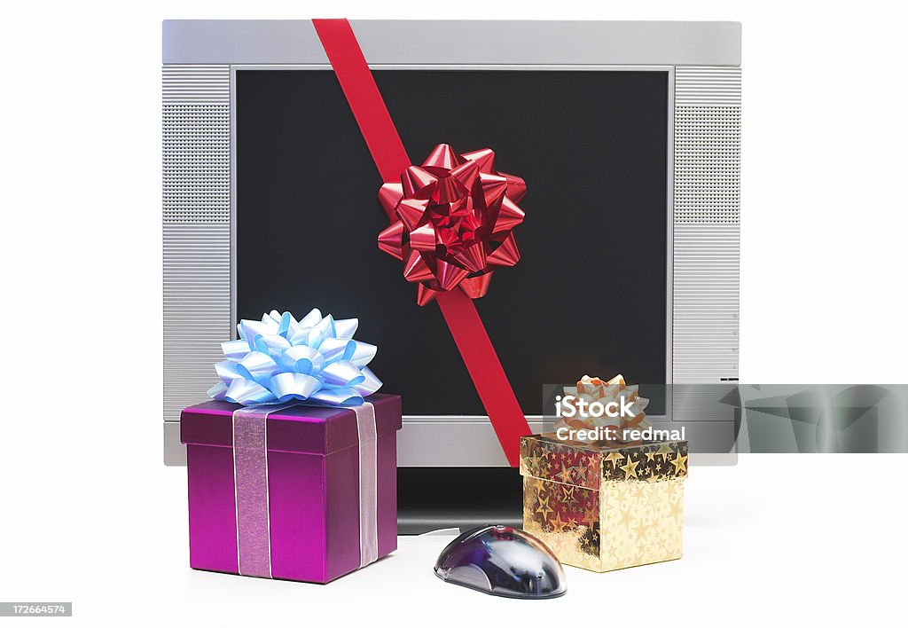 computer presents generic LCD montor gift wrapped with presents and mouse on white backgroundseasonal and festive lightbox Award Stock Photo