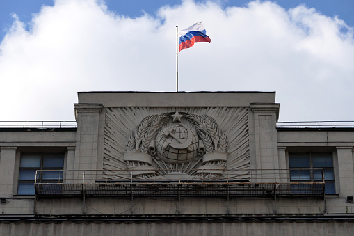 National flag of Russia on the building of the Russian parliament (Duma)
