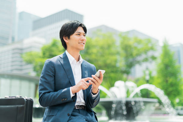 istock Young businessman checking his smartphone in the park 1726652374