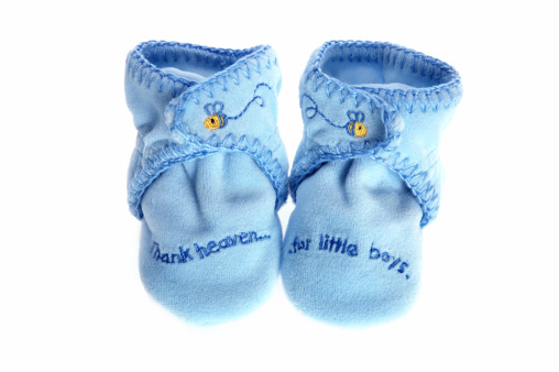 A pair of baby boy's booties shot with Canon 5D.
