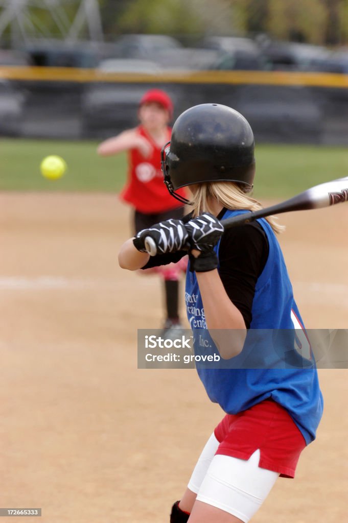 Pitch on the way A softball player waits for the pitch. Softball - Sport Stock Photo